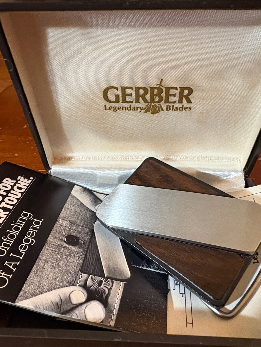 Vintage Gerber Silver tone and Dark Brown Wood Touché belt buckle knife.